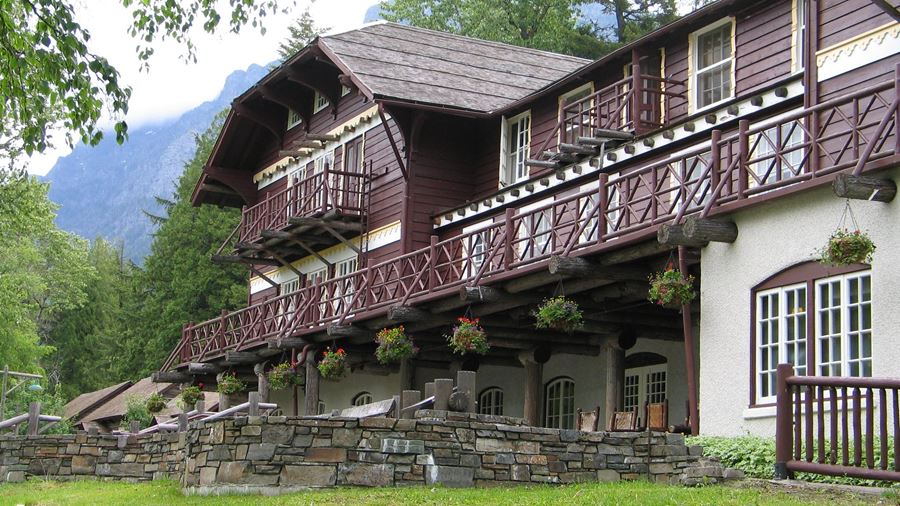 Wooden balconies and stone exterior of Lake McDonald Lodge
