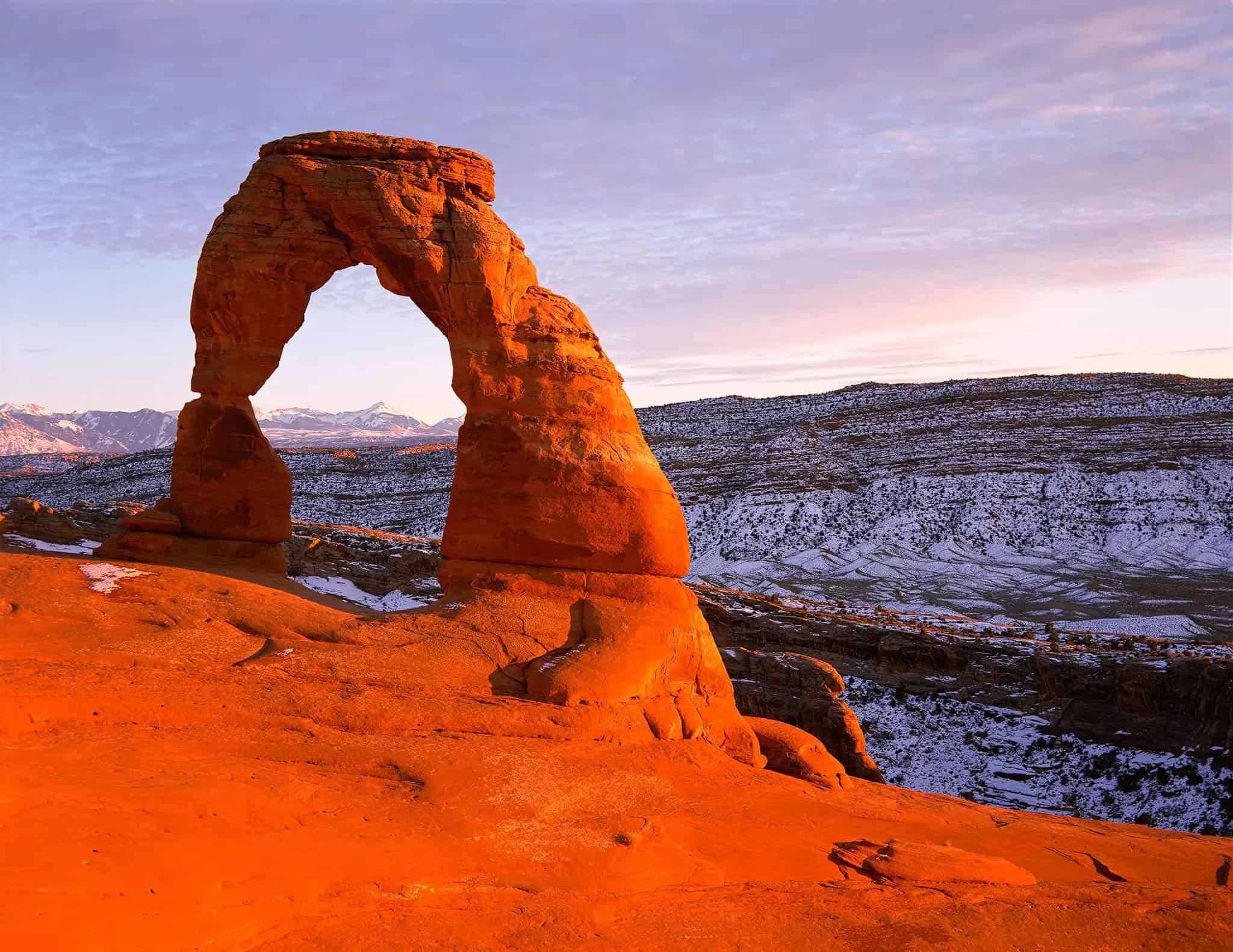 Delicate Arch dusted with snow in winter at Arches National Park
