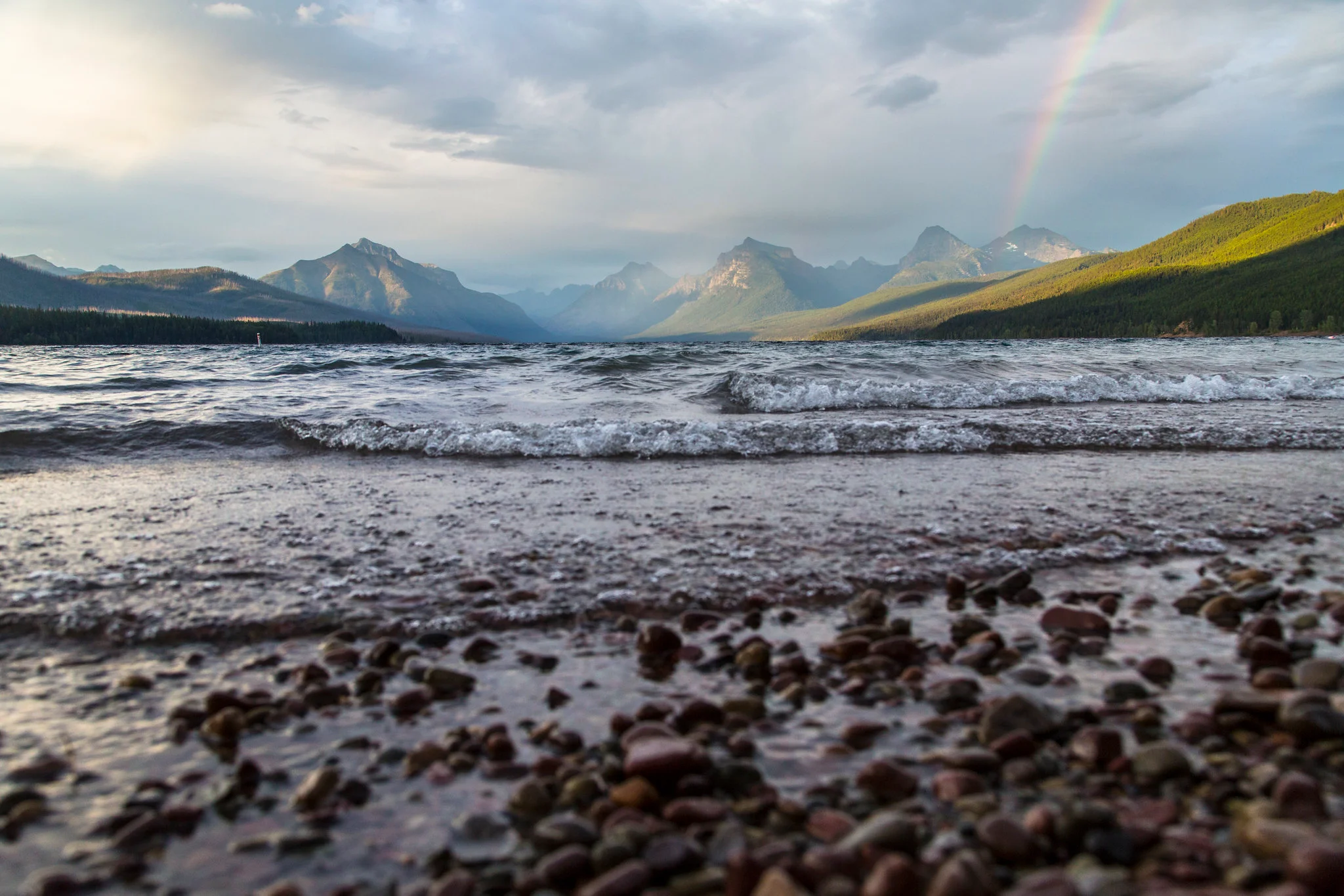 Lake McDonald in Glacier National Park with crystal clear water and mountain reflections