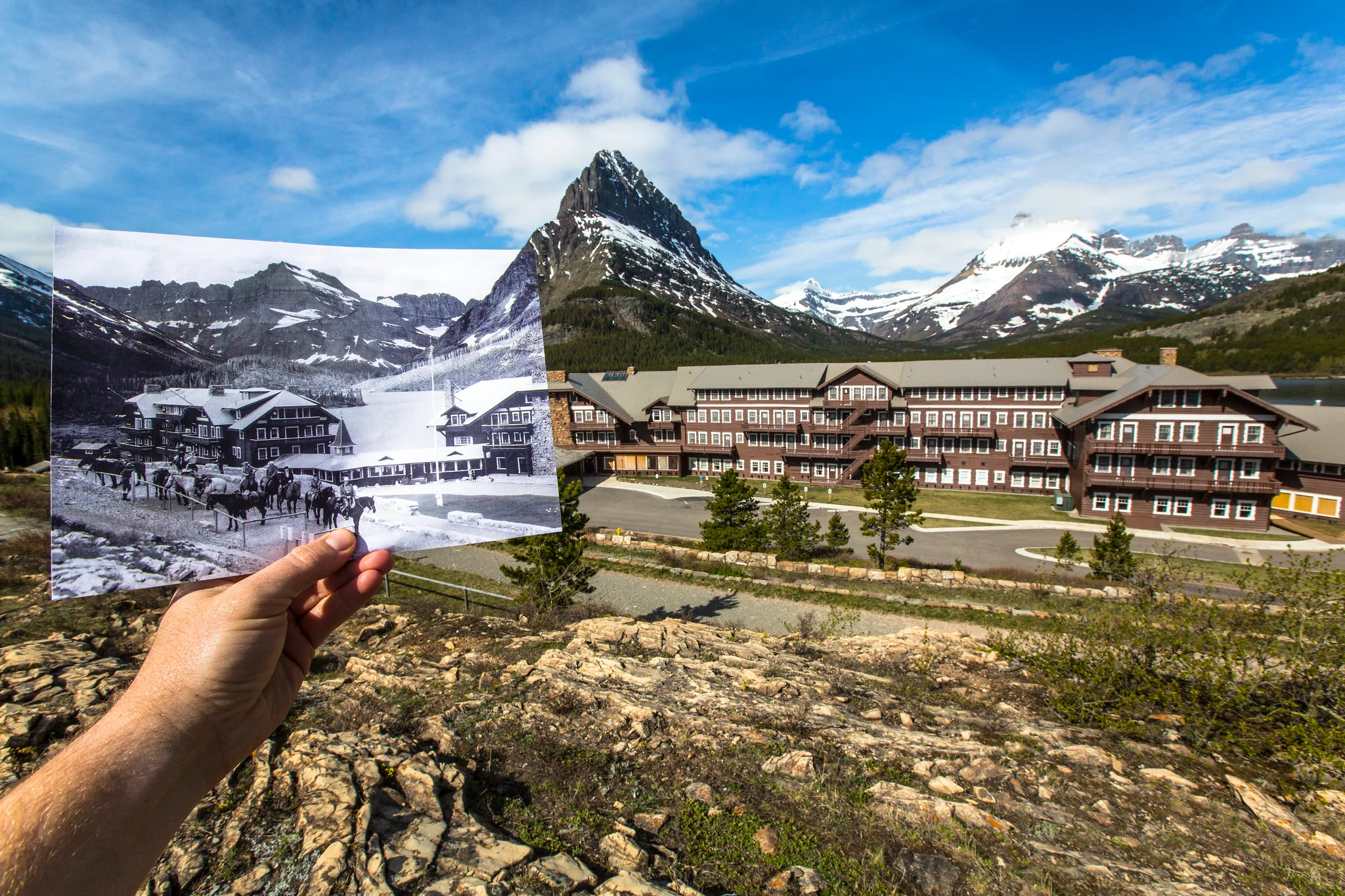 Many Glacier Hotel at sunrise reflected on Swiftcurrent Lake in Glacier National Park