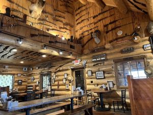 Rustic storefront with wooden signage and stone accents