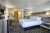 Bright hotel room in Gardiner near Yellowstone Park North, featuring a king bed and modern furnishings in Yellowstone National Park.
