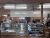 Inside a bakery and deli counter at Yellowstone National Park, serving pastries, sandwiches, and coffee.