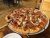 Pizza topped with pepperoni, sausage, olives and peppers at a dining spot in Yellowstone National Park.