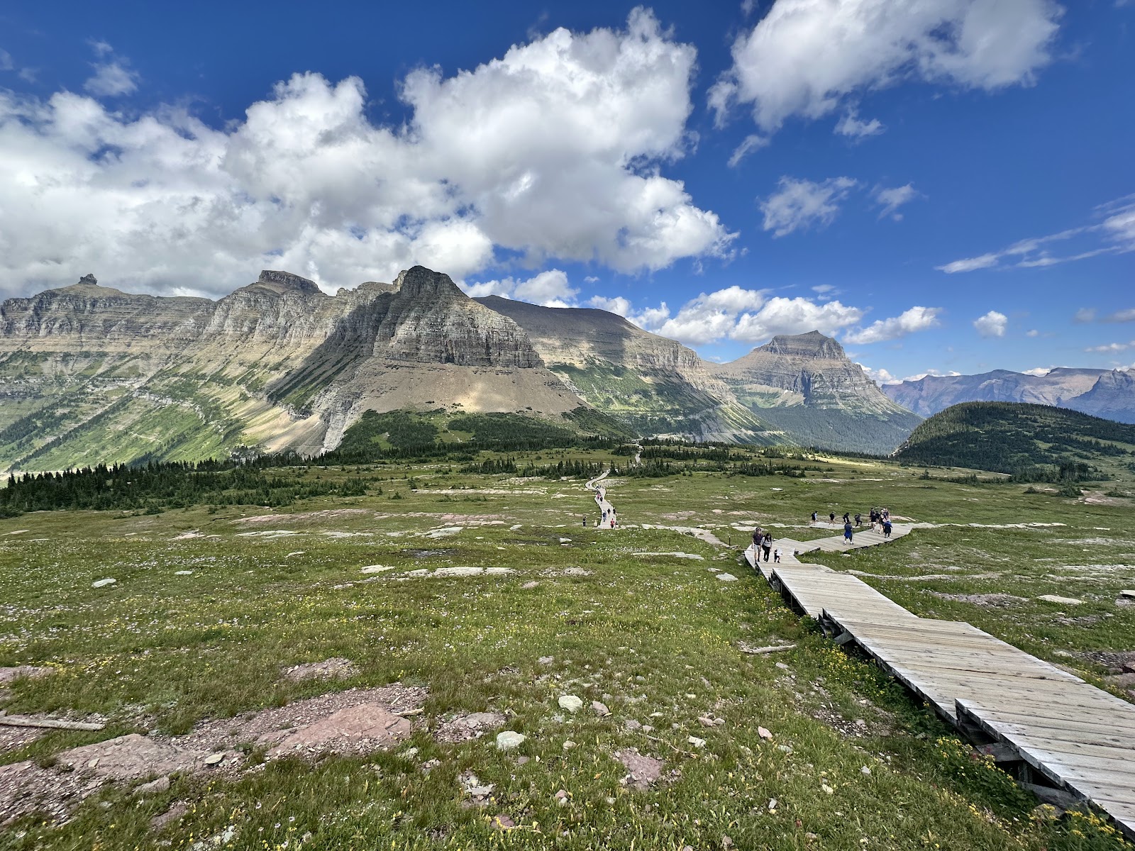 Bright interior with a central information desk and large maps on the wall