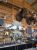 Rustic bar interior in Yellowstone National Park with mounted bison head and large antlers behind a bottle-filled counter.