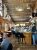 Interior view of Antler Pub & Grill in Yellowstone National Park, rustic timber walls and deer antler décor framing a lively bar scene.