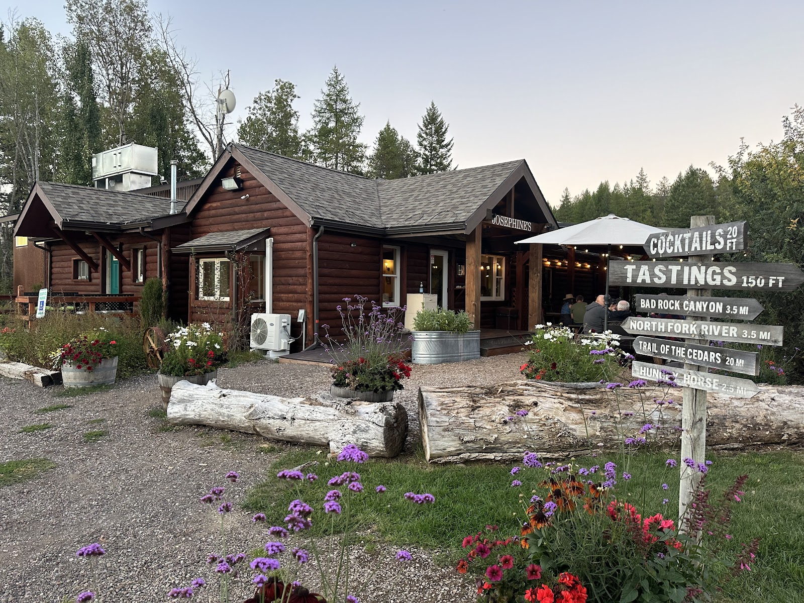 Rustic log restaurant in Glacier National Park offering cocktails and meals near trailheads and lodge area.