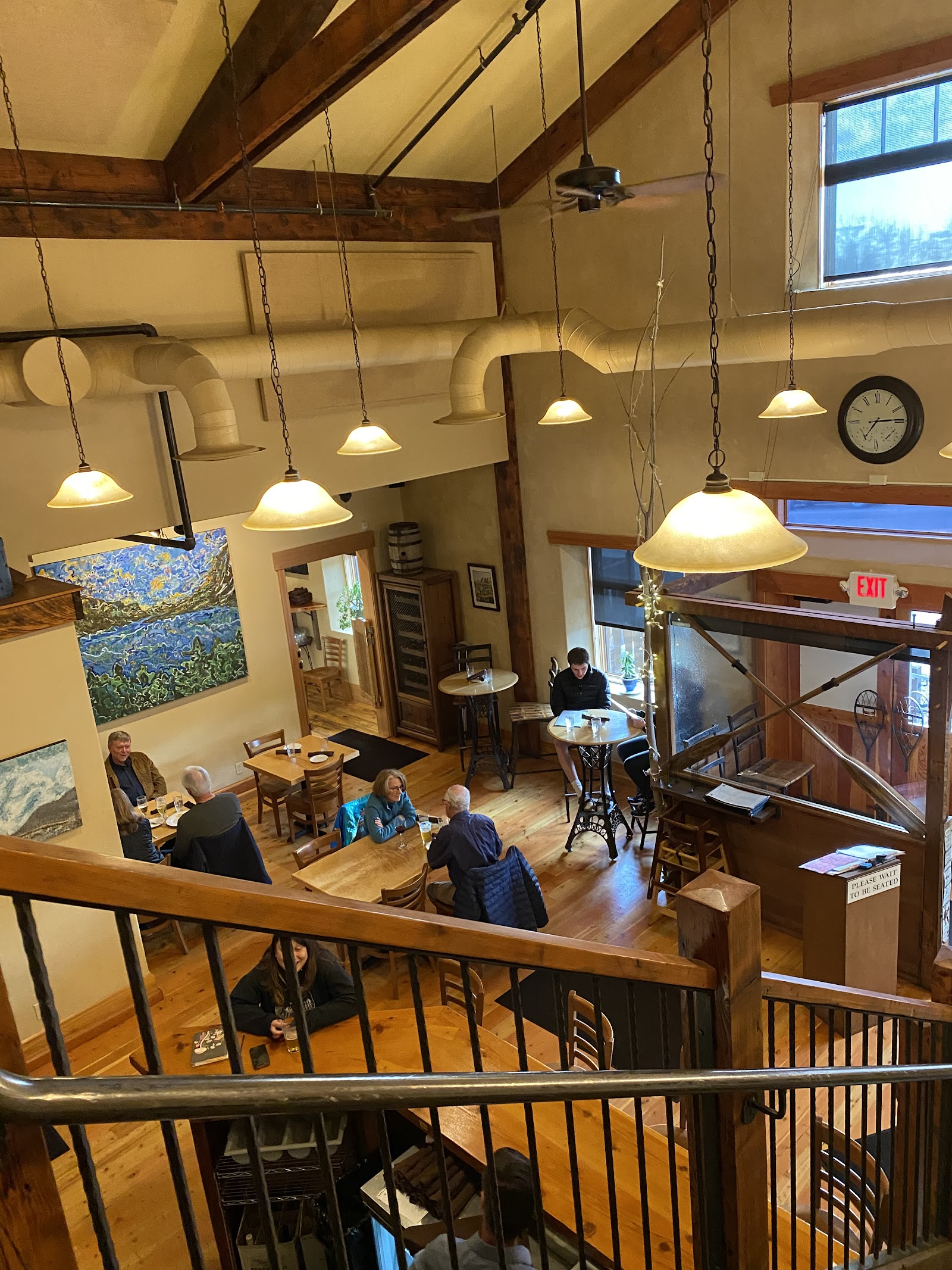 Interior dining room at Three Forks Grille in Glacier National Park, a rustic lodge-style restaurant.
