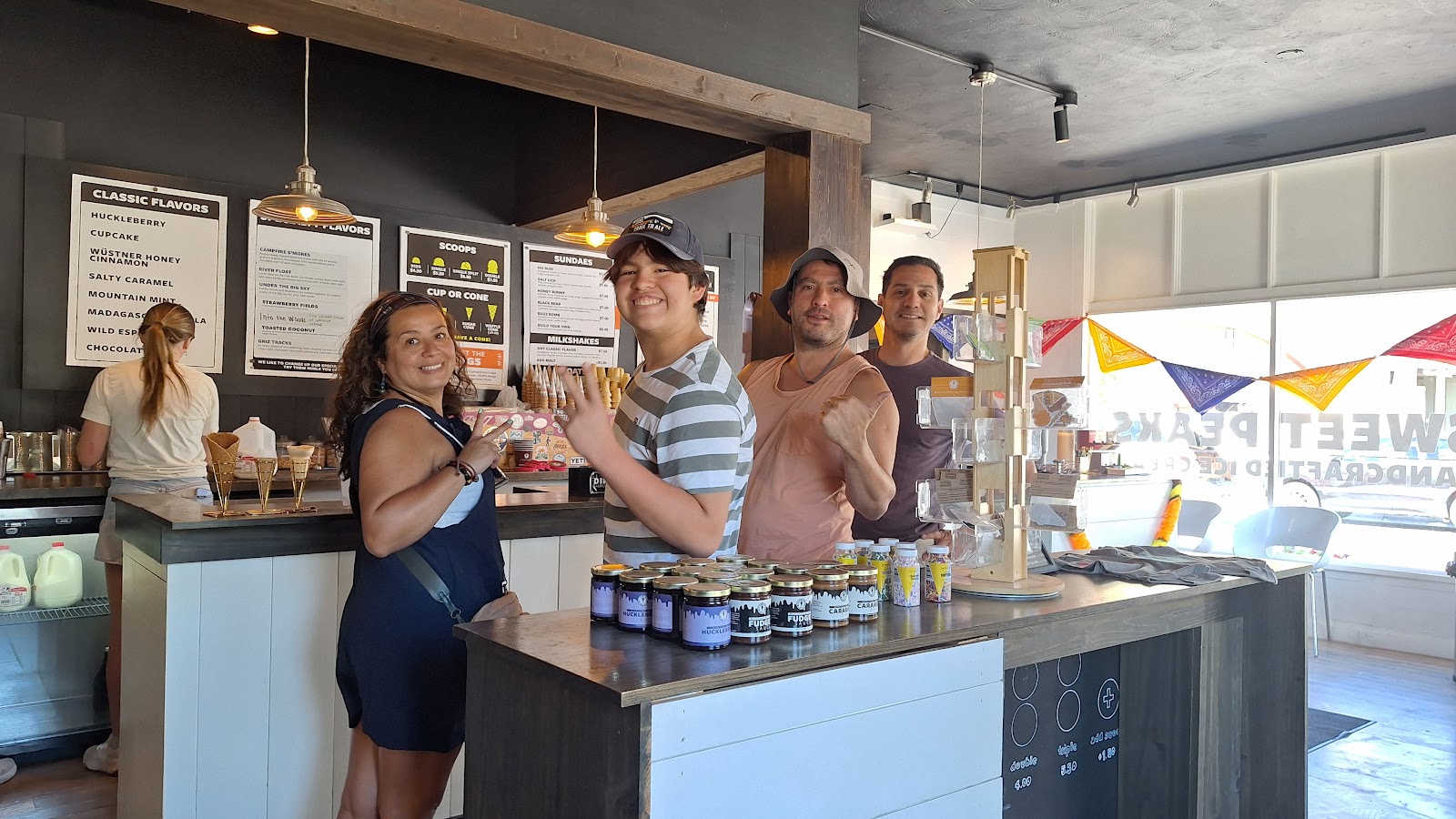 Ice cream shop counter inside Glacier National Park near Whitefish, with visitors ordering at the menu.