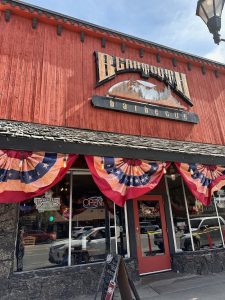 Exterior view of a rustic barbecue restaurant storefront