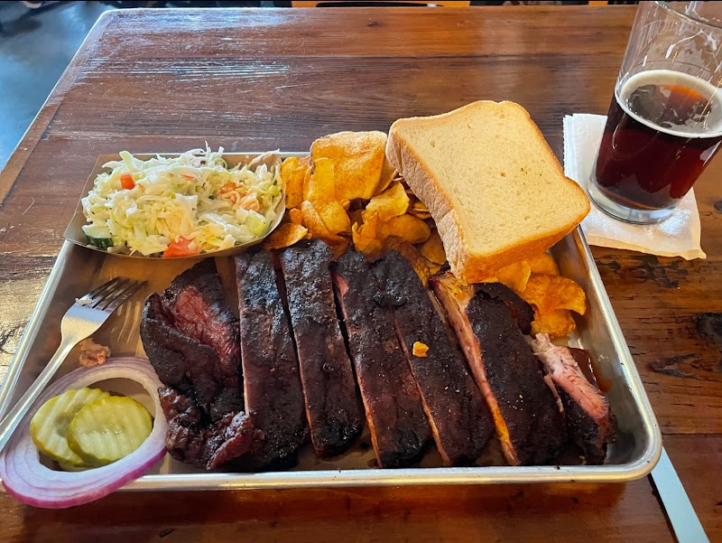 Smoked ribs platter with slaw, pickles, cornbread and fries at Yellowstone National Park.