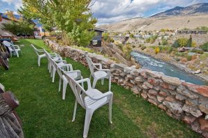 Exterior view of a motel building with a pitched roof, landscaping, and a welcoming entrance