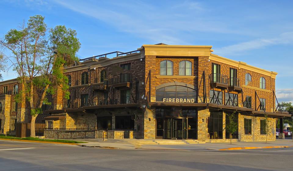 Lodging exterior at a stone-and-brick building near Glacier National Park