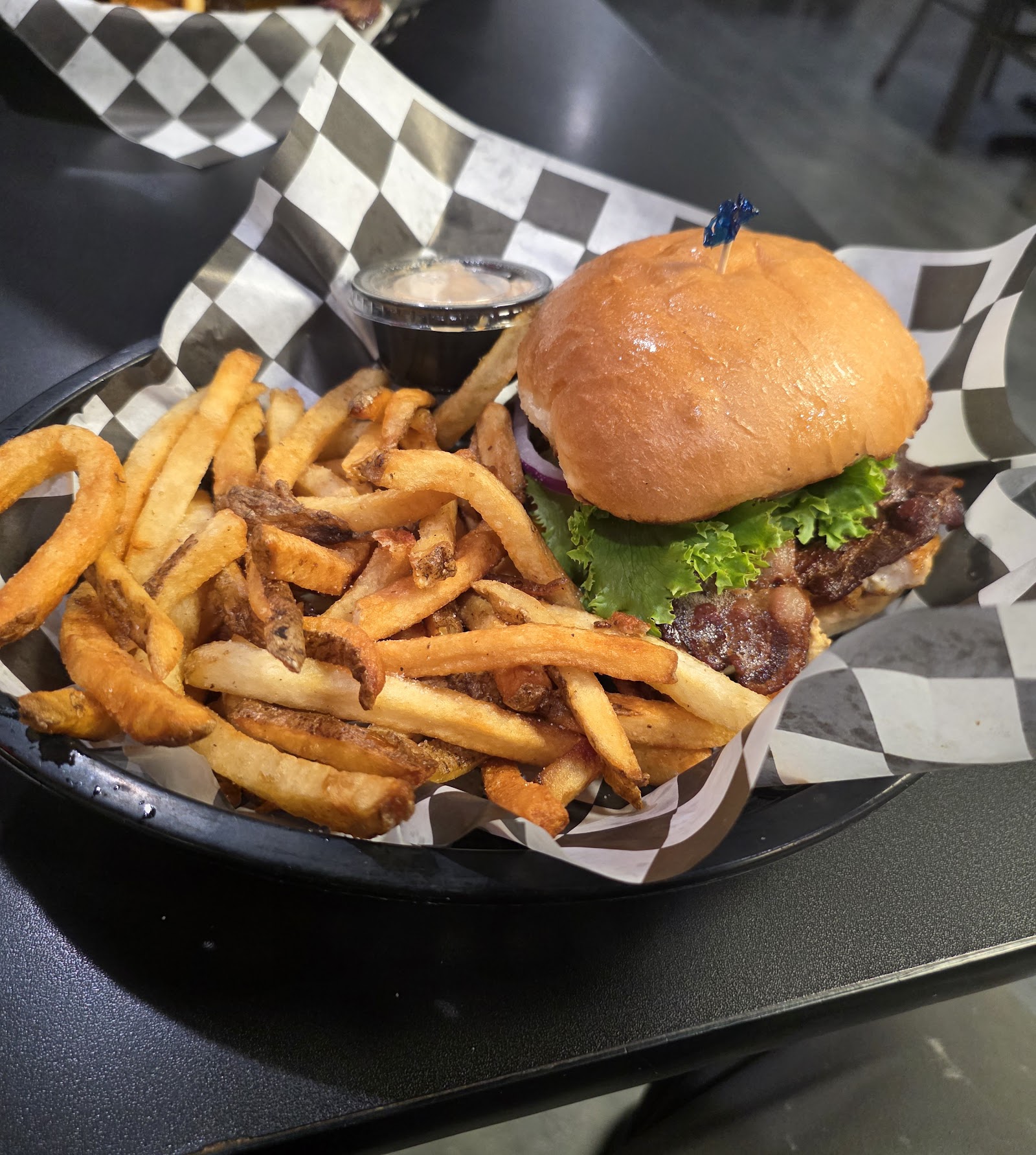 Juicy hamburger with lettuce and a�side of fries served at a Columbia Falls eatery near Glacier National Park.