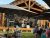 Outdoor stage at Glacier National Park venue hosting a live band for a birthday celebration.