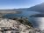 Bear's Hump Trailhead viewpoint overlooking a broad glacier-fed lake in Glacier National Park.