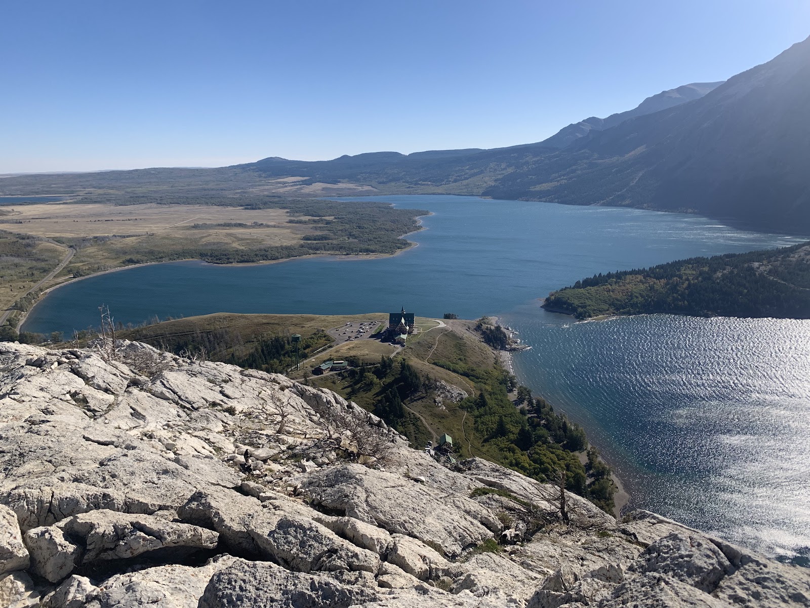 Bear's Hump Trailhead viewpoint overlooking a broad glacier-fed lake in Glacier National Park.
