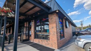 Exterior view of a storefront with bold signage and an awning