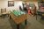 Lobby game room at Yellowstone National Park lodge, featuring foosball and arcade machines.
