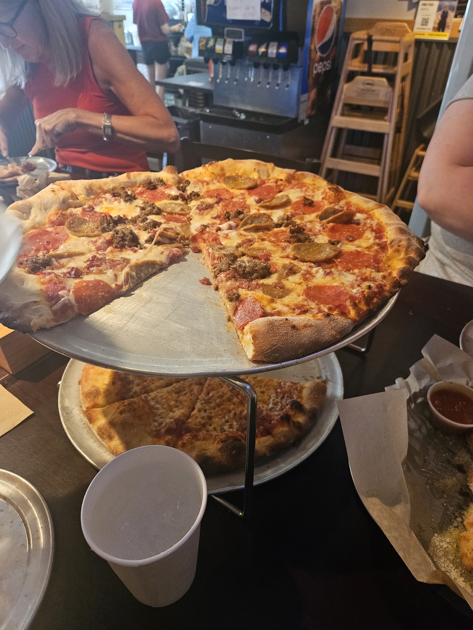Pizza being served at a casual dining counter in Glacier National Park's North Fork area.