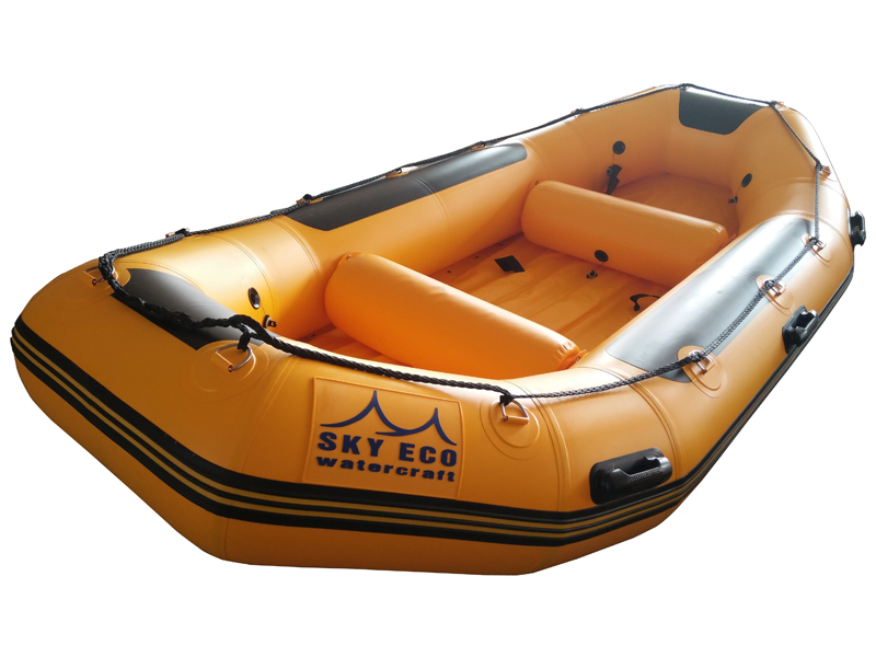 Orange inflatable raft for Glacier National Park gift shop rentals.
