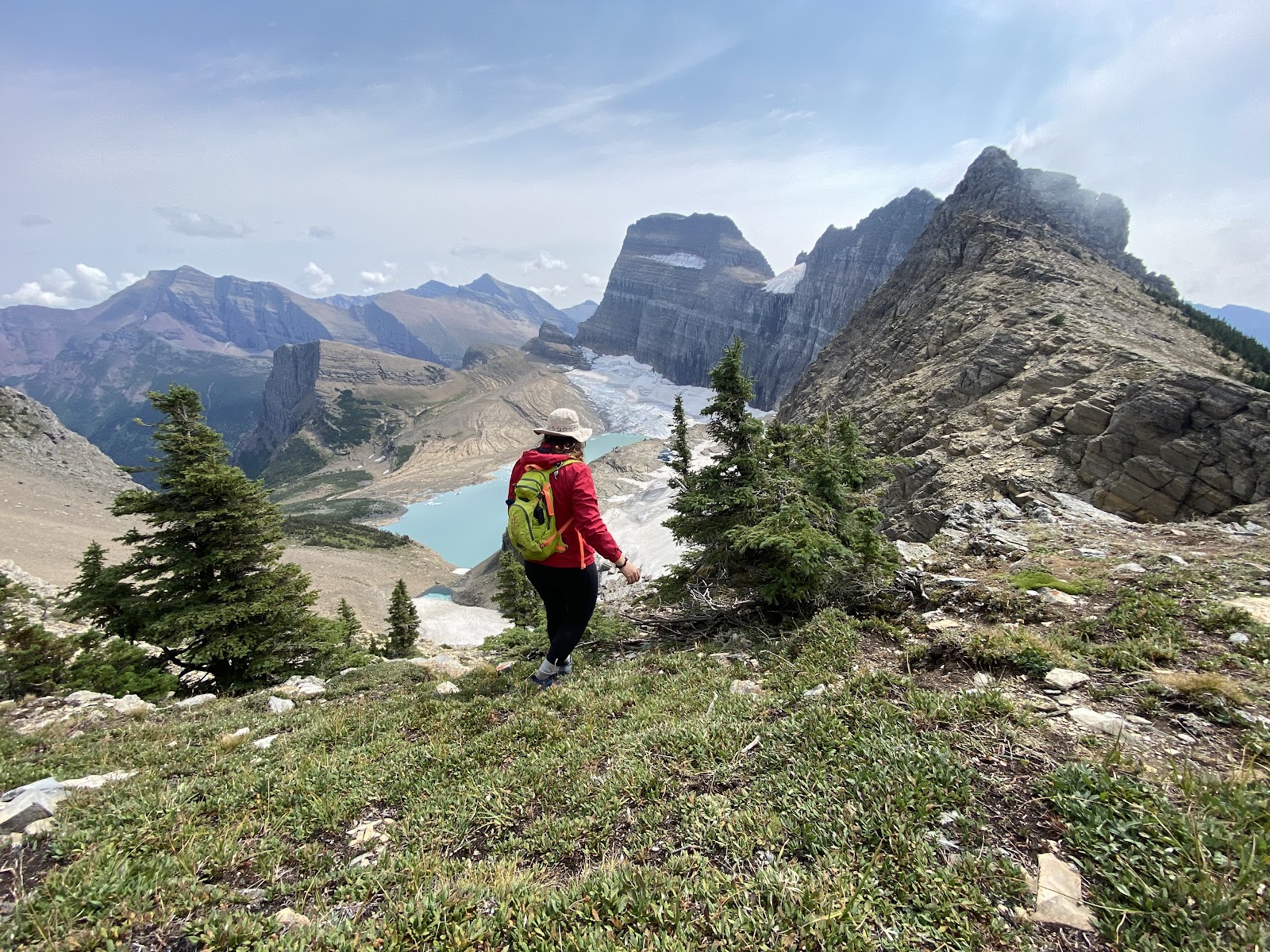 Highline Trail Trailhead in Glacier National Park overlooking rugged ridges and a distant turquoise lake.