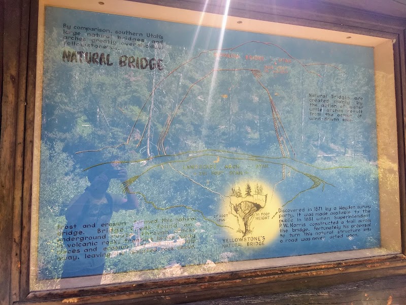 Informational panel map about Natural Bridge in Yellowstone National Park, blue background with a sketch of the bridge and text blocks.