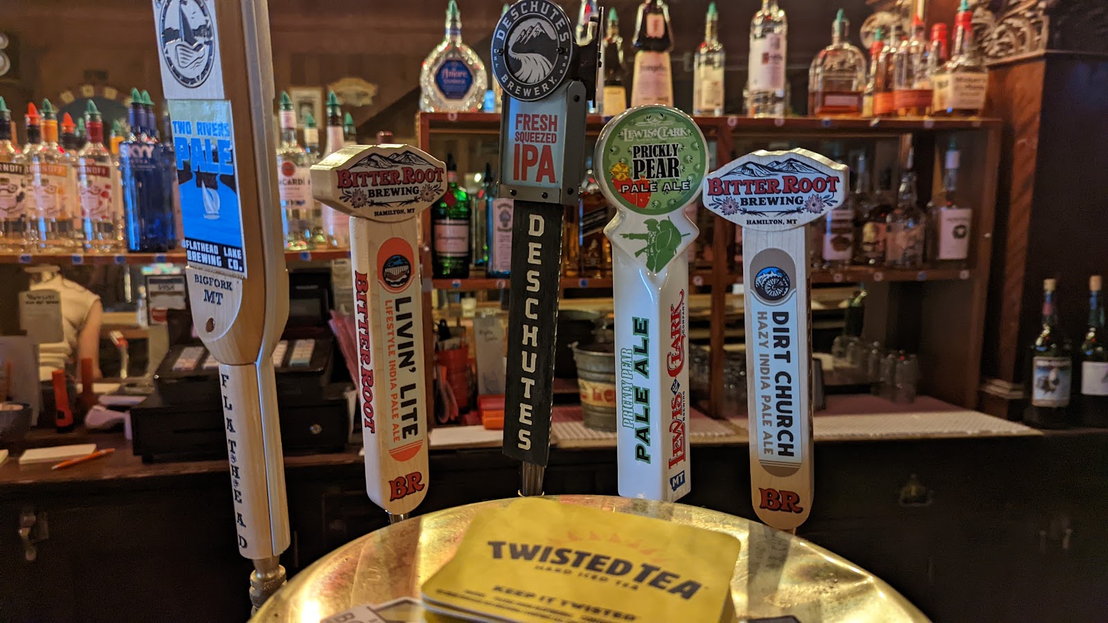Interior view of a Glacier National Park bar with multiple beer taps lining the counter.