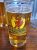 Beer glass at a West Yellowstone eatery in Yellowstone National Park featuring an otter logo.