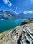 Saint Mary Lake with jagged Glacier peaks under a bright summer sky in Glacier National Park.