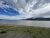 Grant Visitor Center area at Yellowstone National Park offers a lakeside view of Yellowstone Lake with snow-capped ranges.