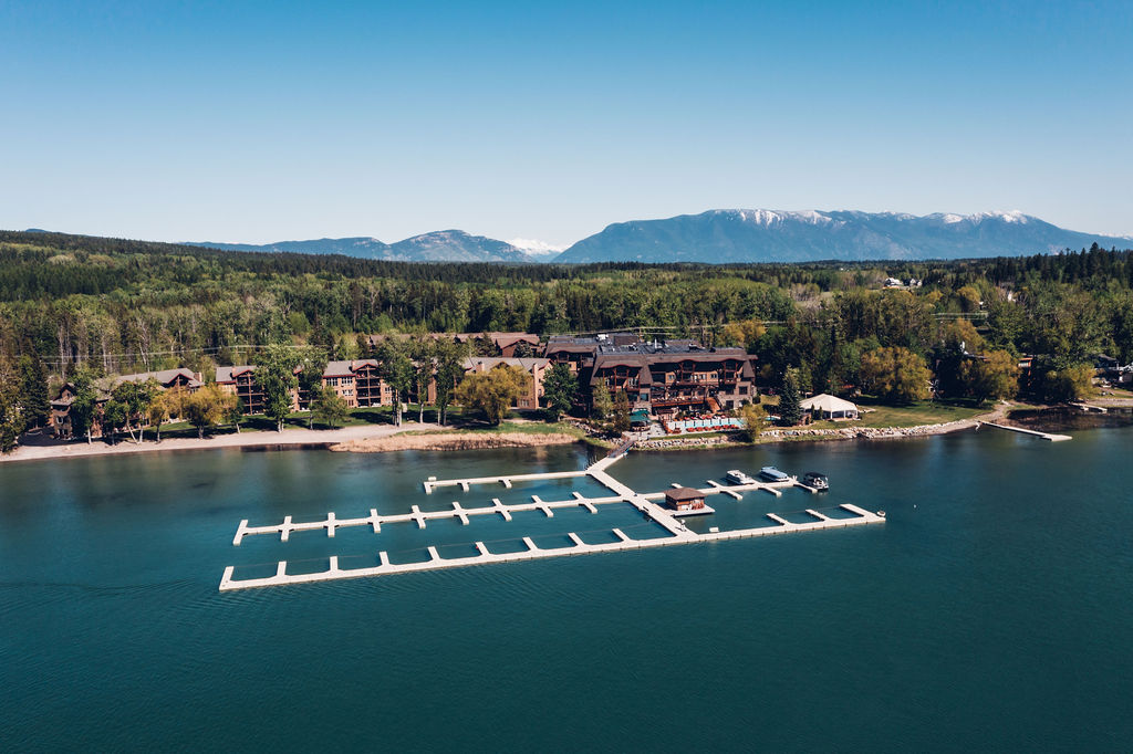 Whitefish Lake shoreline with resort buildings and a marina, Glacier National Park.