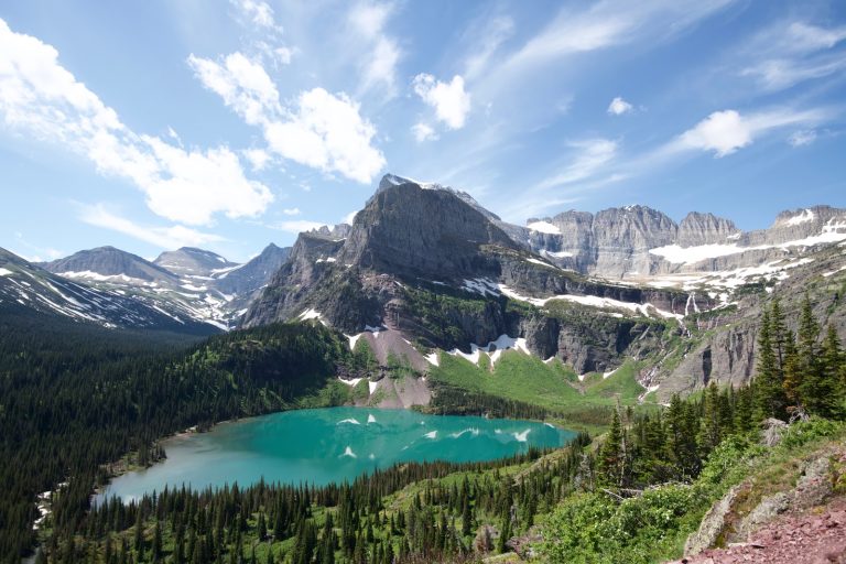 Turquoise Grinnell Lake sits in a glacially-carved basin beneath Glacier National Park's towering peaks.
