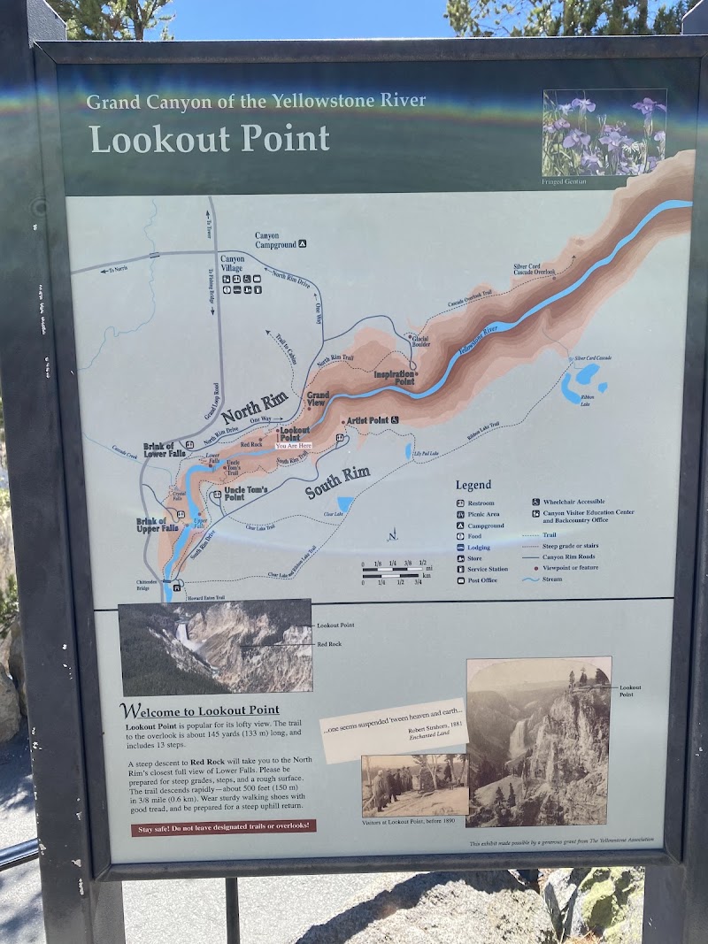 Informational sign at Lookout Point in Yellowstone National Park, showing a Grand Canyon of the Yellowstone map with North and South Rim and trail icons.