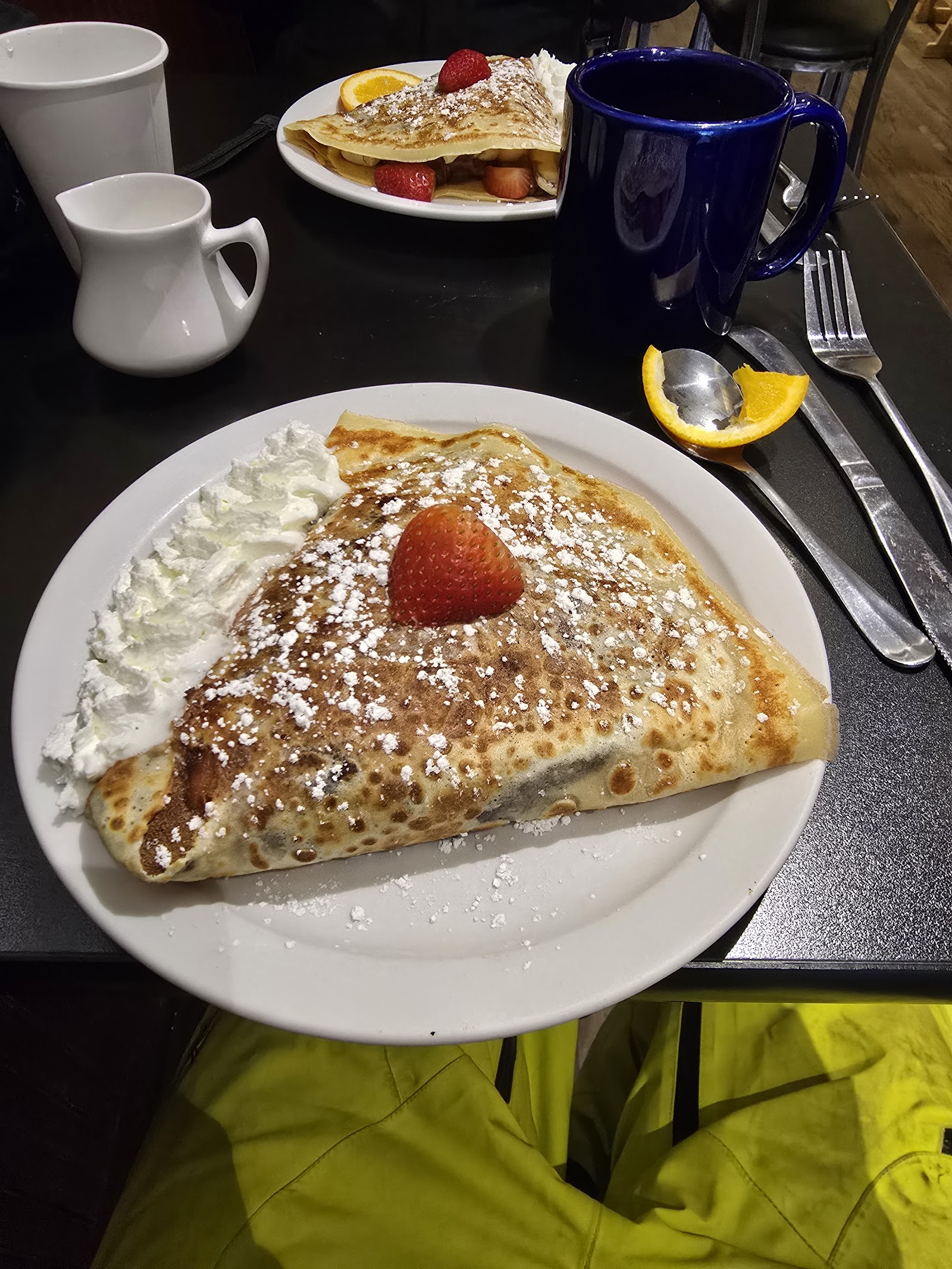 Strawberry-topped crepe with whipped cream at a Glacier National Park restaurant.