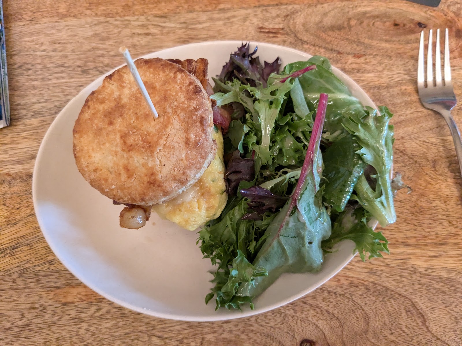 Sandwich with greens plate at Glacier National Park restaurant dining room.