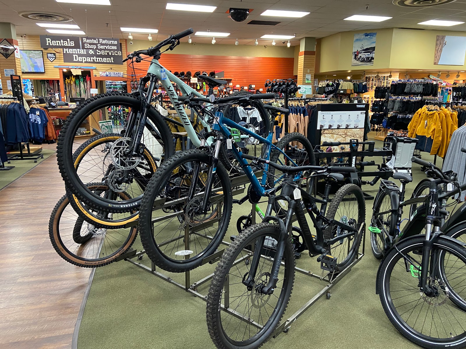 Bike display inside Glacier National Park gift shop, showcasing rental bikes and gear.