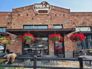Colorful storefront and awning outside with signage