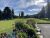 View of Whitefish Lake area in Glacier National Park, with a flower-filled terrace and sunny sky.