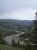 Yellowstone River Picnic Area Trailhead overlooks a winding river through grassy hills in Yellowstone National Park.