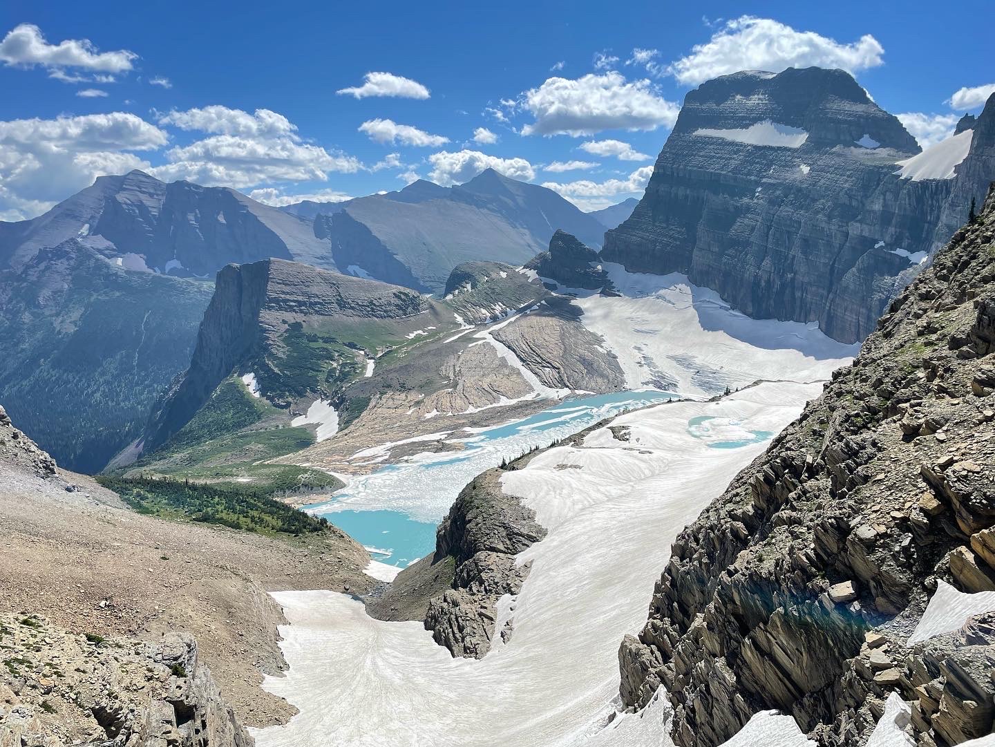 Grinnell Glacier Overlook in Glacier National Park offers dramatic alpine peaks and a turquoise glacier lake.