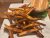 Burger with lettuce and tomato accompanied by a generous pile of fries on a white plate at a Yellowstone dining spot