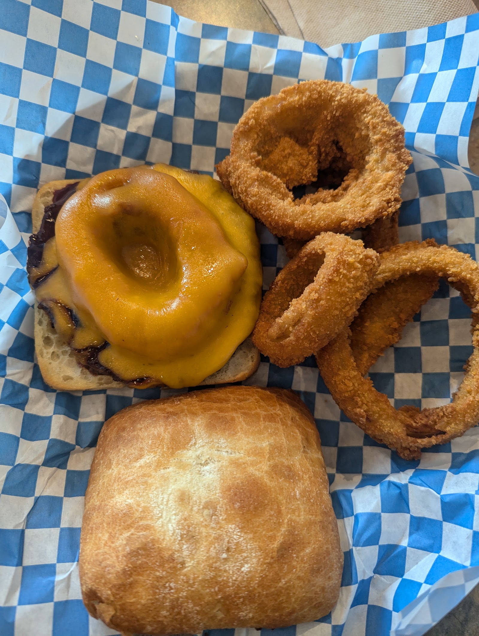 Cheeseburger with melted cheddar and onion rings served at Patch's Alpine Grill in Glacier National Park.