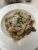 Creamy gnocchi with mushrooms and grated cheese served in a Glacier National Park restaurant dining setting.