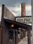 Rustic wooden storefront in Yellowstone National Park with warm porch lights and a vintage sign.