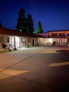 Exterior facade of Lazy Duck Inn with warm lighting and welcoming entrance