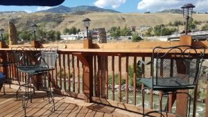 Rustic exterior with wooden facade and outdoor seating area