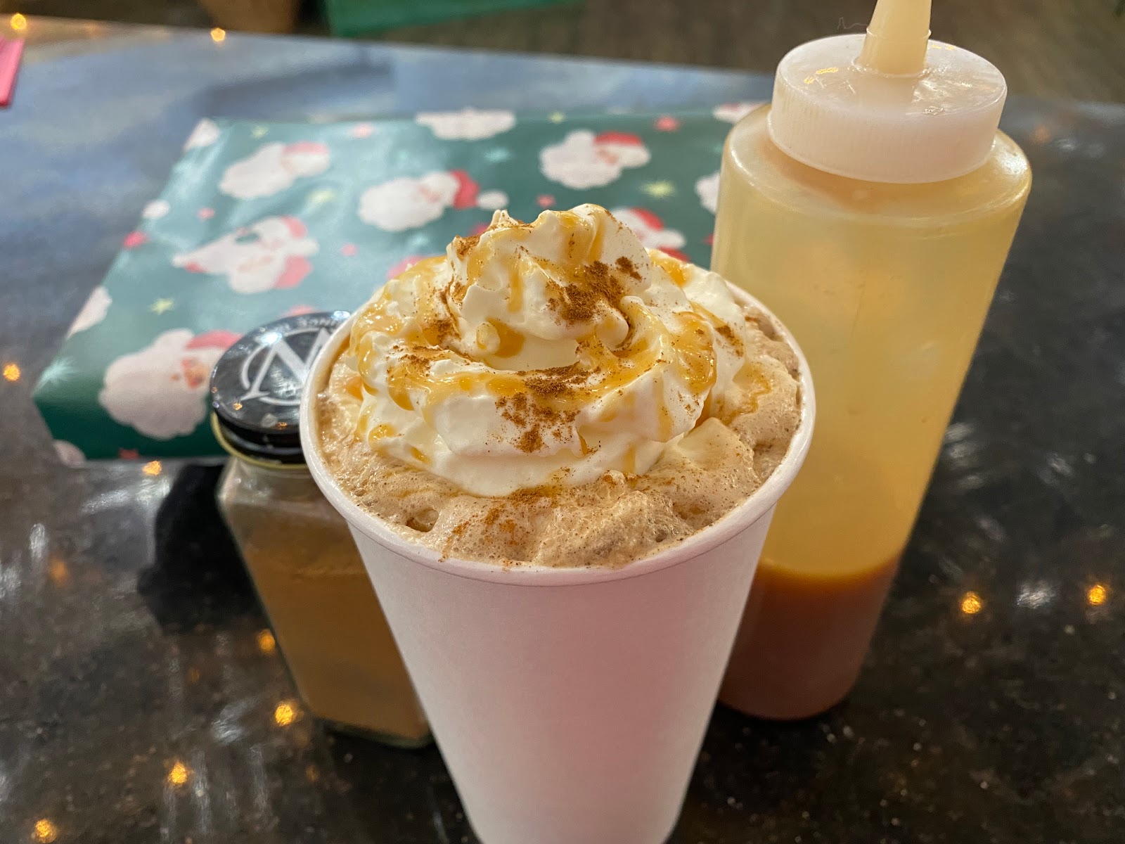 Creamy caramel whipped-cream drink served inside a Glacier National Park cafe during a winter visit.
