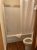 Bathroom in a motel room at Yellowstone National Park, featuring a shower-tub combo and white curtain.